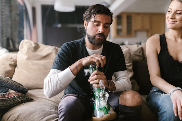 person holding a bong